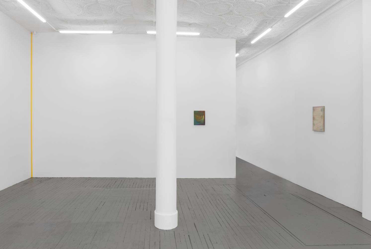 room with 2 paintings