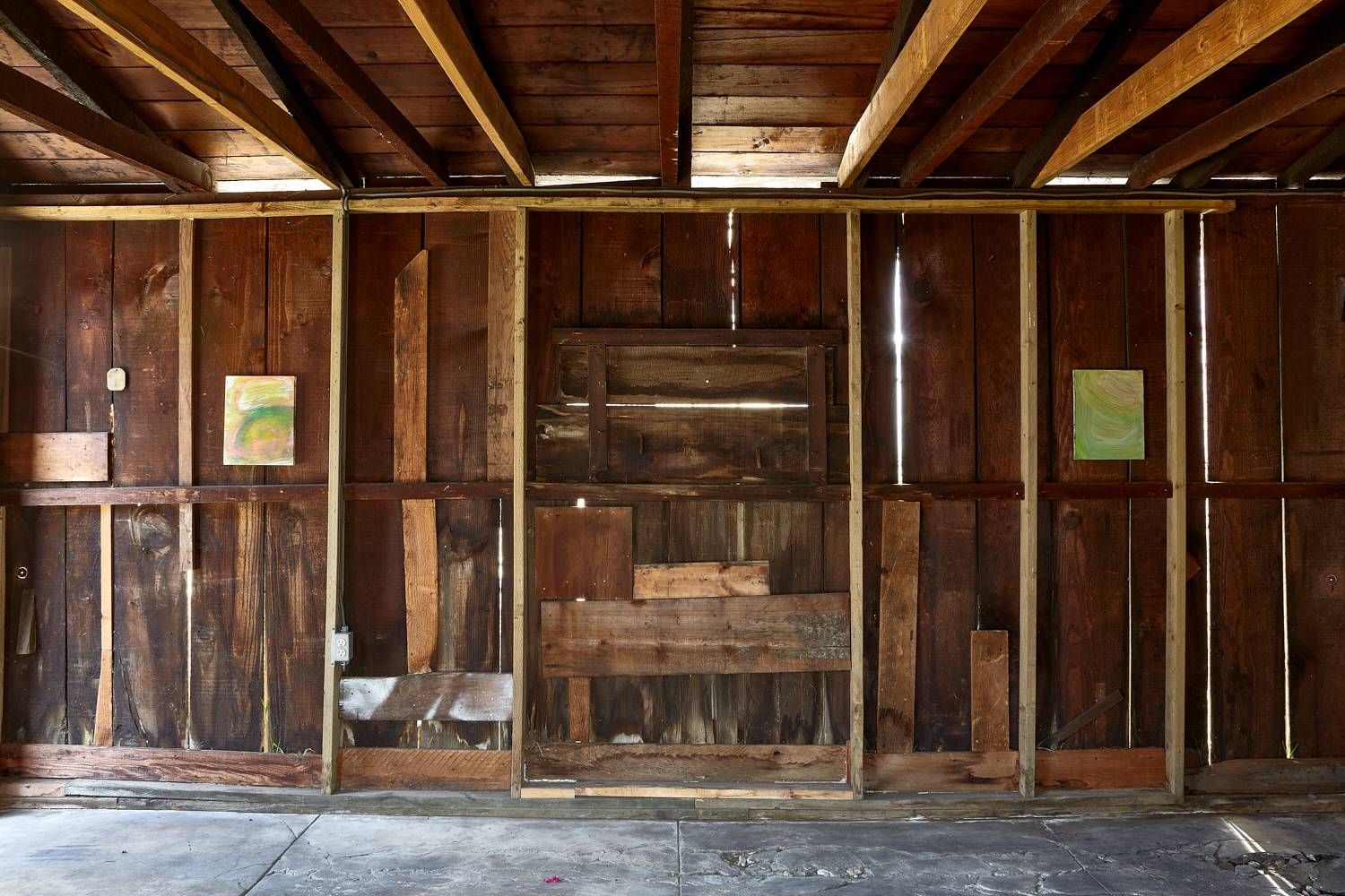rustic room with paintings